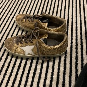 Kids golden goose size 34 tornd up but it’s fine there golden goose